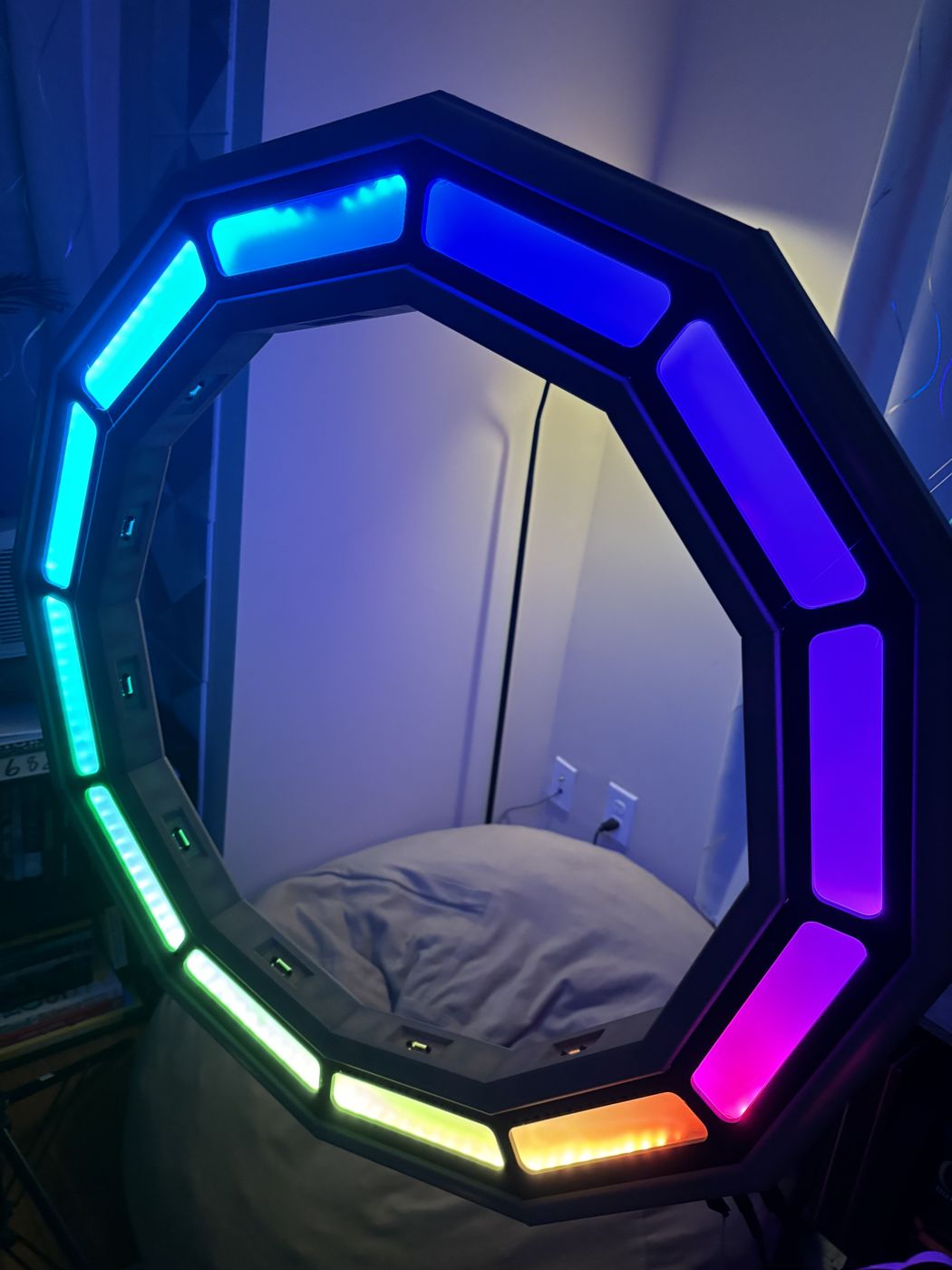 Auralis lit up, with each ring segment glowing a different color